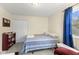 Bright bedroom with a bed, closet, and a bright window at 2539 S Edgewood Cv, Martinsville, IN 46151