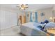 Cozy bedroom featuring soft carpet, a ceiling fan, and a warm, inviting ambiance at 2539 S Edgewood Cv, Martinsville, IN 46151