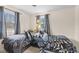 Bedroom featuring two beds, carpeted floors, and bright windows at 2539 S Edgewood Cv, Martinsville, IN 46151