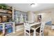 Charming dining room with a built-in bench, bright windows, and stylish decor at 2539 S Edgewood Cv, Martinsville, IN 46151