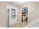 Welcoming entryway with a decorative front door, staircase and coat rack at 2539 S Edgewood Cv, Martinsville, IN 46151