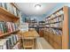 Cozy home library with floor-to-ceiling bookshelves and a comfortable desk for reading and work at 2539 S Edgewood Cv, Martinsville, IN 46151