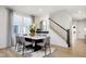 Bright dining room with large window and modern table perfect for gatherings at 2634 Penn Ave, Plainfield, IN 46168