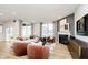 Bright living room featuring a fireplace, TV, and comfortable seating arrangements at 2634 Penn Ave, Plainfield, IN 46168