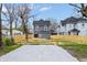 Backyard featuring a wood fence, parking spaces, and newly installed grass at 2748 Carrollton Ave, Indianapolis, IN 46205