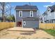 Backyard featuring a deck, wood fence and newly installed grass at 2748 Carrollton Ave, Indianapolis, IN 46205