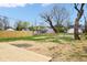 Backyard featuring a deck, wood fence and newly installed grass at 2748 Carrollton Ave, Indianapolis, IN 46205