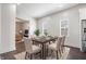 Elegant dining room with a wooden table and seating for six, adjacent to the kitchen at 2748 Carrollton Ave, Indianapolis, IN 46205