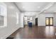 Open-concept view of kitchen with blue island and stainless steel appliances, connected to spacious room at 2748 Carrollton Ave, Indianapolis, IN 46205