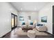 Cozy living room with plush seating, stylish decor, and access to an outdoor patio at 2748 Carrollton Ave, Indianapolis, IN 46205