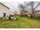 Backyard patio with seating area and mature trees creating a relaxing outdoor space at 305 Beacon Point Ln, Fortville, IN 46040