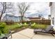 Spacious backyard with lush lawn and seating area ideal for outdoor gatherings at 305 Beacon Point Ln, Fortville, IN 46040