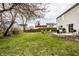 Well-maintained backyard featuring a lush green lawn and a patio area at 305 Beacon Point Ln, Fortville, IN 46040
