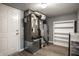 Furnace room contains a water heater, furnace and an empty bookshelf against the gray painted wall at 305 Beacon Point Ln, Fortville, IN 46040
