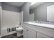 Bathroom featuring modern vanity, mirror, and shower with tub at 305 Beacon Point Ln, Fortville, IN 46040