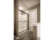 Bathroom features a stand up shower with a glass door and chrome hardware at 305 Beacon Point Ln, Fortville, IN 46040