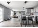 Bright kitchen featuring a center island, modern appliances, and an open flow into the living area at 305 Beacon Point Ln, Fortville, IN 46040