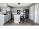 Well-equipped kitchen boasting gray cabinets, stainless steel appliances, and a functional island at 305 Beacon Point Ln, Fortville, IN 46040