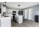 Modern kitchen with an island, black appliances, and stylish cabinets for cooking and entertaining at 305 Beacon Point Ln, Fortville, IN 46040