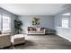 Comfortable living room featuring neutral tones, plush seating, and stylish decor creating a welcoming space at 305 Beacon Point Ln, Fortville, IN 46040