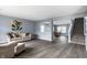 Open-concept living room showcases hardwood floors, staircase, and neutral colors for a modern aesthetic at 305 Beacon Point Ln, Fortville, IN 46040