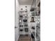 Walk-in pantry features wire shelving for ample storage of food items, cookware and kitchen appliances at 305 Beacon Point Ln, Fortville, IN 46040