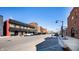 A view of the street highlighting commercial buildings in the town and parking spaces at 305 Beacon Point Ln, Fortville, IN 46040
