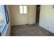 Bedroom with neutral walls, carpet, and a window looking to the outside at 318 Chester St, Anderson, IN 46012