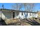 Weathered single-story home featuring a covered porch and visible signs of wear at 318 Chester St, Anderson, IN 46012