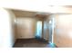 Empty living room featuring neutral walls, carpet, and doorway leading to bedroom at 318 Chester St, Anderson, IN 46012