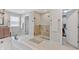 Bathroom featuring a large shower with glass door and tile surround at 3240 Wildlife Trl, Zionsville, IN 46077