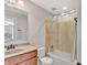 Full bathroom with a single sink vanity, a toilet, and shower tub combo with a clear curtain at 3240 Wildlife Trl, Zionsville, IN 46077