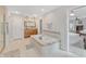 Spa-like bathroom with soaking tub, double vanity, and separate shower at 3240 Wildlife Trl, Zionsville, IN 46077
