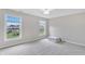 Bedroom with two large windows for lots of light and neutral walls with neutral carpeting at 3240 Wildlife Trl, Zionsville, IN 46077