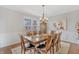 Elegant dining room with wooden table, chairs, chandelier, and detailed trim at 3240 Wildlife Trl, Zionsville, IN 46077