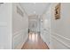 Inviting hallway with detailed molding and hardwood flooring at 3240 Wildlife Trl, Zionsville, IN 46077