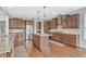 Modern kitchen featuring granite countertops, stainless steel appliances, and custom cabinetry at 3240 Wildlife Trl, Zionsville, IN 46077