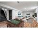 Finished basement offers a versatile recreational space with foosball table and comfortable seating area at 3445 N Olney St, Indianapolis, IN 46218