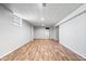 Spacious basement features hardwood floors, white walls, and recessed lighting at 3445 N Olney St, Indianapolis, IN 46218