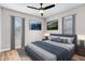 Cozy bedroom showcasing a modern bed with plush bedding, stylish decor, and ample natural light at 3445 N Olney St, Indianapolis, IN 46218