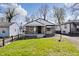 Charming single-story home featuring a stone facade, covered porch, and well-maintained lawn at 3445 N Olney St, Indianapolis, IN 46218