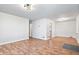 Open concept living area with hardwood flooring, neutral walls, and modern lighting fixtures at 3445 N Olney St, Indianapolis, IN 46218