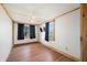 Bedroom featuring wood laminate flooring, light walls, and television at 3721 S 575 W, Trafalgar, IN 46181