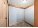 Cozy closet with gray carpet, blue walls trimmed with wood, and a light fixture at 3721 S 575 W, Trafalgar, IN 46181