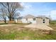 Rear exterior of home features a wooden deck and concrete patio at 3721 S 575 W, Trafalgar, IN 46181