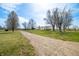 Exterior shot of house with long driveway and mature trees at 3721 S 575 W, Trafalgar, IN 46181