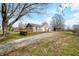 Charming home featuring a spacious wooden deck and gravel driveway at 3721 S 575 W, Trafalgar, IN 46181