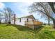 Exterior house featuring a chimney and wooden deck extending the side of the property with green grass at 3721 S 575 W, Trafalgar, IN 46181