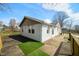Wide shot of the property's exterior with a wooden deck and view of the house and surrounding greenery at 3721 S 575 W, Trafalgar, IN 46181