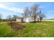 Exterior showing landscaped yard, garden plot and painted brick at 3721 S 575 W, Trafalgar, IN 46181